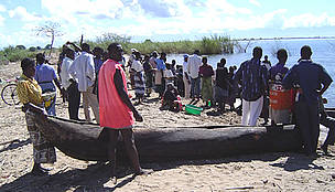 Waiting for fishermen to bring a day's catch to the shore on lake Malawi.