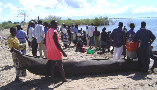 Waiting for fishermen to bring a day's catch to the shore on lake Malawi.
