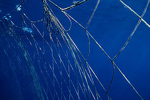 Fishermen's nets set out to corral Northern bluefin tuna (Thunnus thynnus) during the migration, Mediterranean Sea.