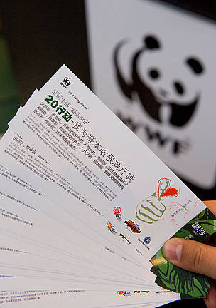 Advice cards in chinese language, produced by WWF, on how to reduce your carbon footprint, COP 15, United Nations Climate Change Conference, Copenhagen, Denmark.